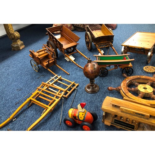 7140 - A quantity of handmade wooden carts, a musical wooden circus railway carriage (working), various spa... 