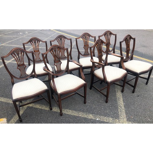 7148 - A set of 8 reproduction mahogany dining chairs with cream drop seats, 2 carvers, 6 singles