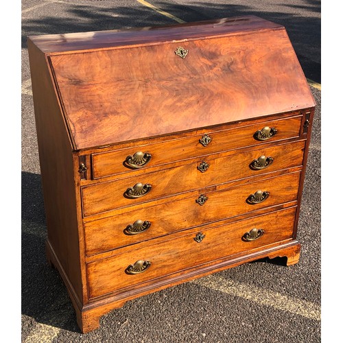 7151 - A George III mahogany bureau with fall front enclosing inner compartments and small drawers, 2 lower... 