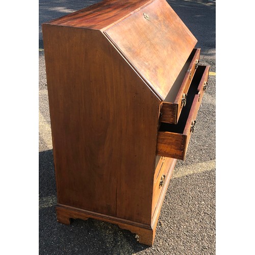 7151 - A George III mahogany bureau with fall front enclosing inner compartments and small drawers, 2 lower... 