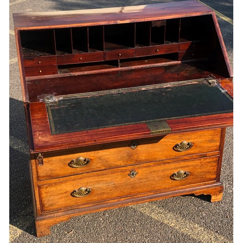 7151 - A George III mahogany bureau with fall front enclosing inner compartments and small drawers, 2 lower... 