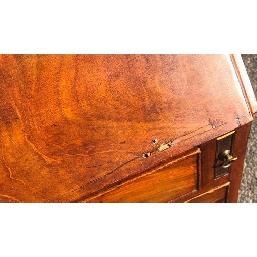 7151 - A George III mahogany bureau with fall front enclosing inner compartments and small drawers, 2 lower... 