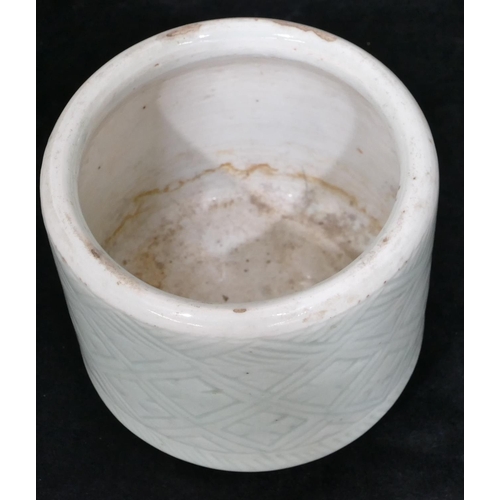 102 - A Chinese celadon round brush pot, 11cm high