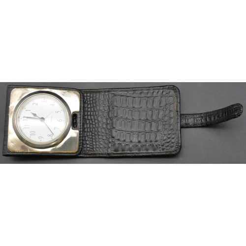 142 - A modern 925 silver plated travelling time piece in leather case with white enamel dial and Arabic n... 