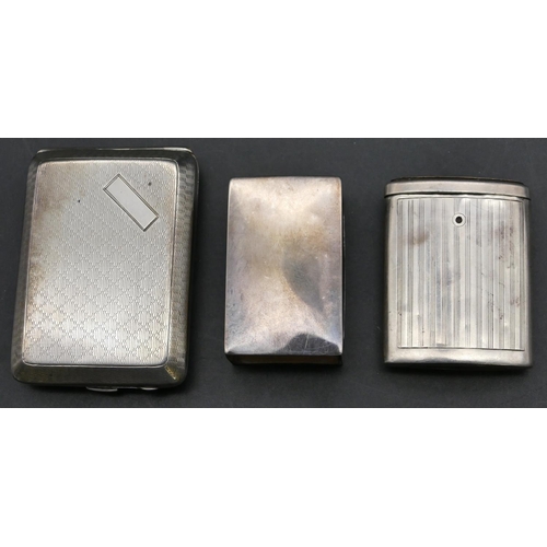 158 - A Birmingham silver matchbox case holder with engine turned decoration with hinged front, an oval Bi... 