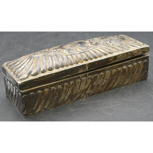 166 - A Birmingham silver rectangular shaped curling tongs box with allover embossed decoration, hinged li... 