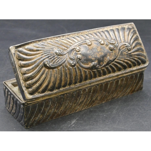 166 - A Birmingham silver rectangular shaped curling tongs box with allover embossed decoration, hinged li... 