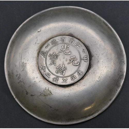 174 - An Oriental small round dish with raised zodiac animals inset with coin, 9.8cm diameter