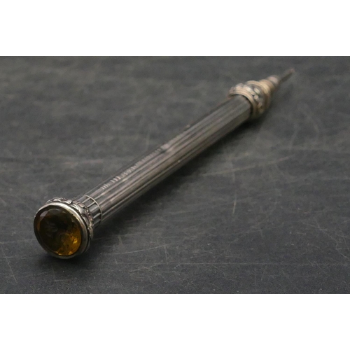 176 - S. Mordan & Co. reeded silver propelling pencil mounted with yellow seal stone to end, 9.5cm long cl... 