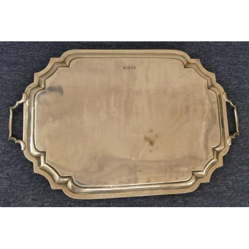 188 - A George V silver rectangular scallop shaped 2-handled tray with engraved crest and inscription to c... 