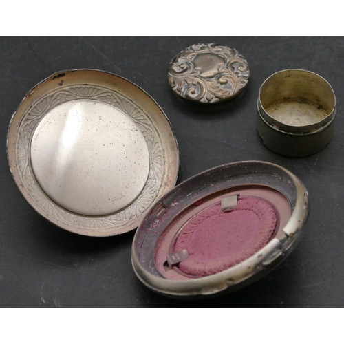 199 - A miniature Birmingham silver round pill box with embossed lid, a silver coloured metal circular com... 