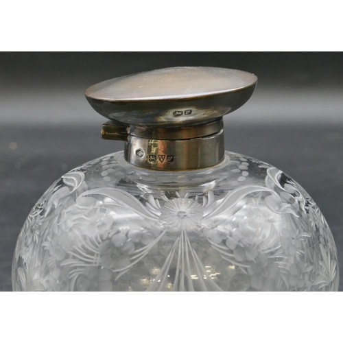 202 - A cut glass round bulbous shaped scent bottle with Chester silver hinged lid enclosing inner stopper... 