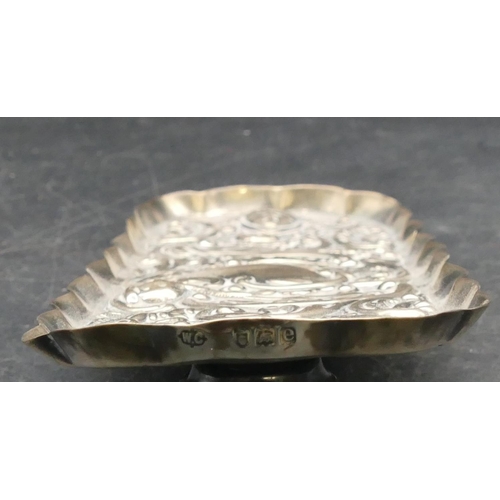 204 - A late Victorian oblong scallop shaped silver pin dish with embossed figurehead and scroll decoratio... 