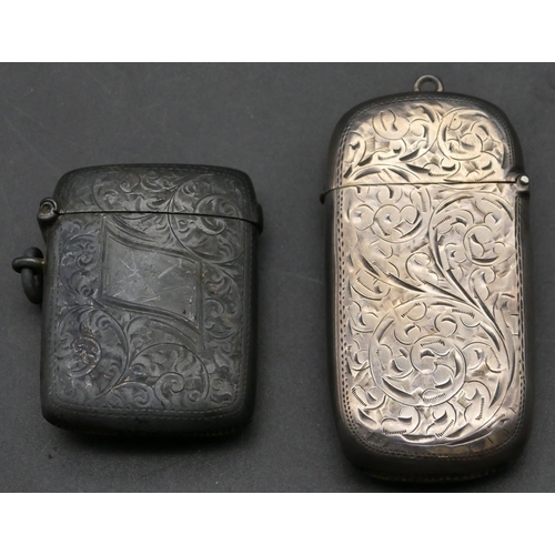 215 - A Birmingham oblong silver vesta case with hinged lid and allover chased scroll decoration, another ... 