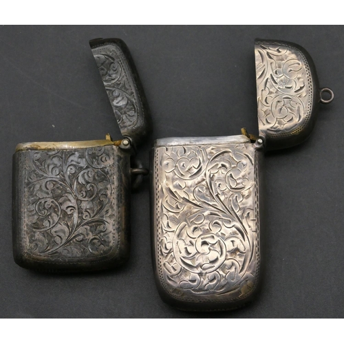 215 - A Birmingham oblong silver vesta case with hinged lid and allover chased scroll decoration, another ... 