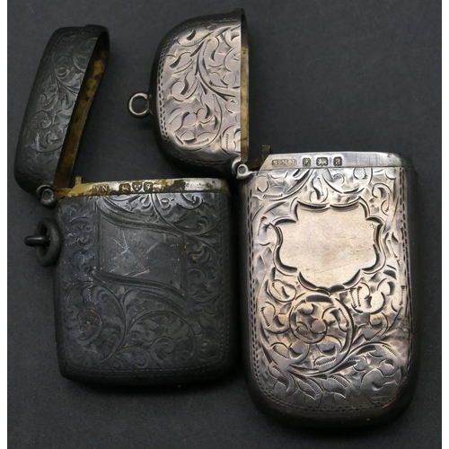 215 - A Birmingham oblong silver vesta case with hinged lid and allover chased scroll decoration, another ... 