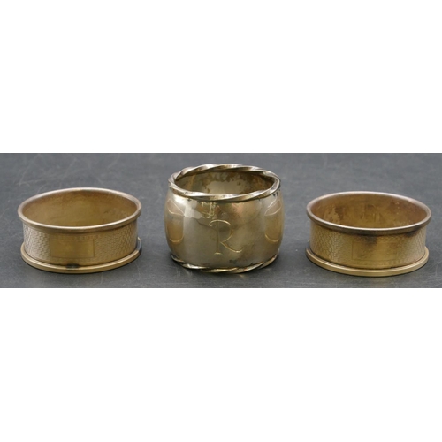 218 - A pair of Birmingham silver round napkin rings with engine turned decoration, also a heavy Edinburgh... 