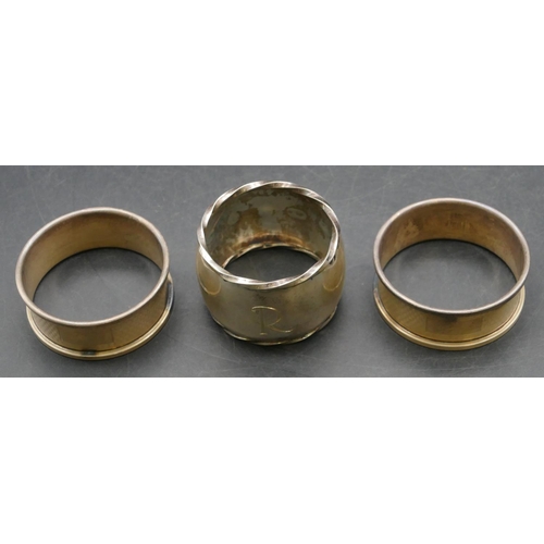 218 - A pair of Birmingham silver round napkin rings with engine turned decoration, also a heavy Edinburgh... 