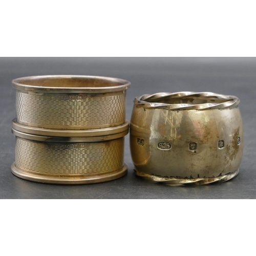 218 - A pair of Birmingham silver round napkin rings with engine turned decoration, also a heavy Edinburgh... 