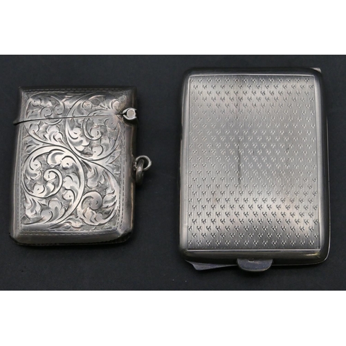 223 - A Birmingham silver vesta case with chased scroll decoration and hinged lid, also a Birmingham silve... 