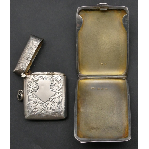 223 - A Birmingham silver vesta case with chased scroll decoration and hinged lid, also a Birmingham silve... 