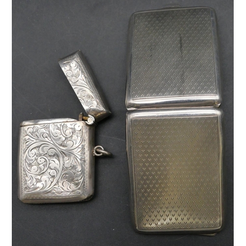 223 - A Birmingham silver vesta case with chased scroll decoration and hinged lid, also a Birmingham silve... 