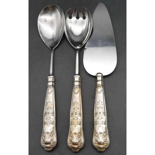 240 - A pair of Sheffield silver handled salad servers with embossed decoration and a similar Sheffield si... 