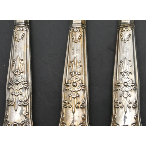 240 - A pair of Sheffield silver handled salad servers with embossed decoration and a similar Sheffield si... 