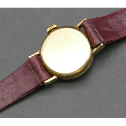 246 - A 9ct gold ladies' Centaur circular wristwatch with red leather strap, approx. 6.3 grams gross witho... 