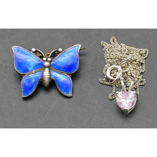 251 - A Sterling silver small brooch in the form of a butterfly with blue enamel decoration, 2.2cm wide, a... 