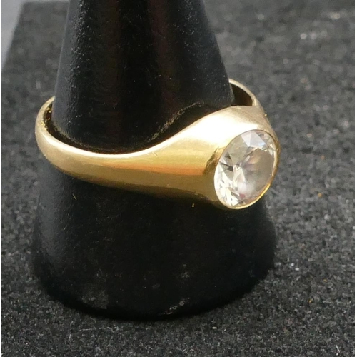 257 - An 18ct gold ring set with clear stone, Size U/V, 4.2 grams gross