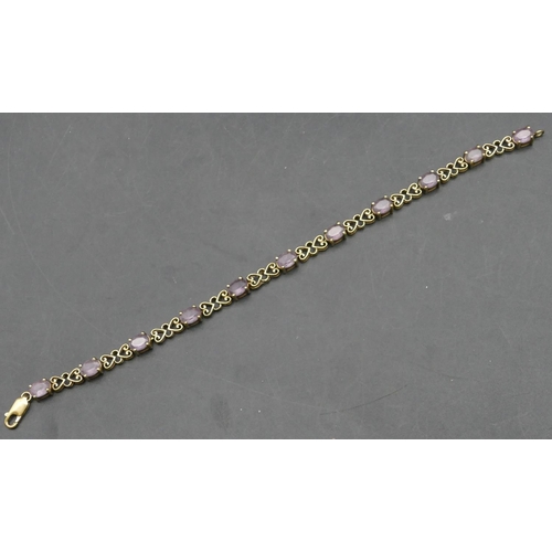 260 - A 9ct gold bracelet set with pale purple stones, 20cm long, 10.9 grams gross