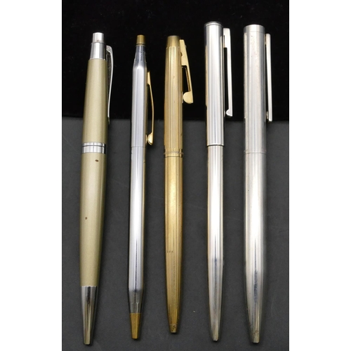 263 - An Asprey silver ballpoint pen with black velvet case, a Tiffany & Co. 925 silver ballpoint pen, an ... 