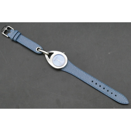 264 - An Asprey modern stainless steel wristwatch with blue face and pale blue leather strap