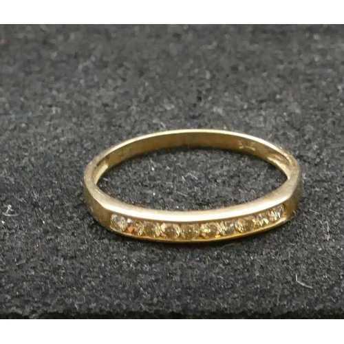 268 - A 9ct gold ladies' half eternity ring set with 10 small diamonds, Size Q, 1.1 grams