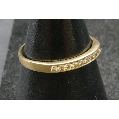 268 - A 9ct gold ladies' half eternity ring set with 10 small diamonds, Size Q, 1.1 grams