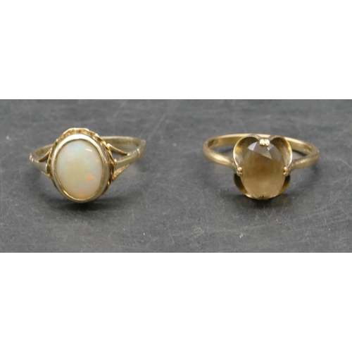 275 - A gold ladies' oval ring set with opal, Size N/O, a 9ct gold ladies' ring set with smoky quartz styl... 