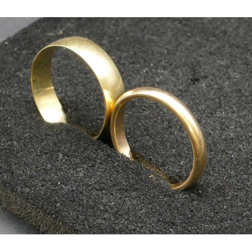 276 - A high carat gold wedding ring, size P/Q, 2.3 grams, a 9ct gold wedding ring, Size T/U, 2.3 grams (2... 