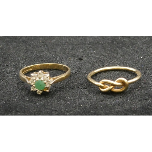 277 - A 9ct gold ladies' cluster ring set with centre green stones surrounded by clear stones (1 stone mis... 