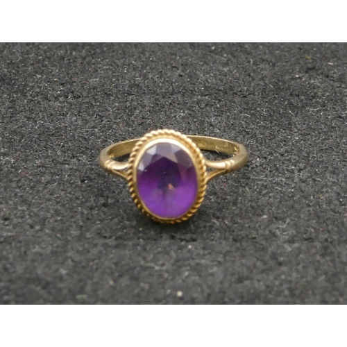 278 - A 9ct gold ladies' oval ring set with amethyst, Size N, 2.1 grams gross