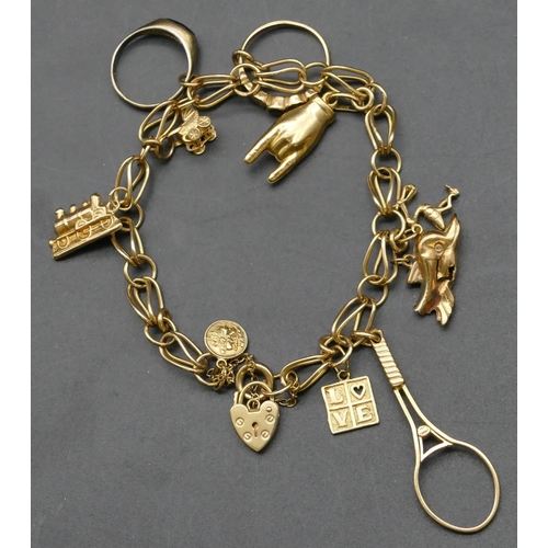 282 - A 9ct gold linked bracelet mounted with 10 gold charms, 20.8 grams gross