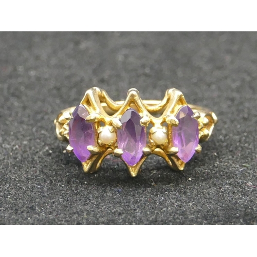 291 - A 9ct gold ladies' cluster ring set with 3 amethysts interspersed by 2 small half pearls, Size Q/R, ... 