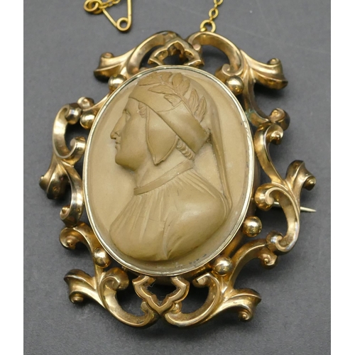 295 - An oval lava cameo with raised figurehead of a gentleman in pierced and embossed frame, 5.5cm high o... 