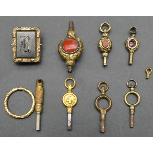 299 - 6 various watch keys and a gilt metal tie clip