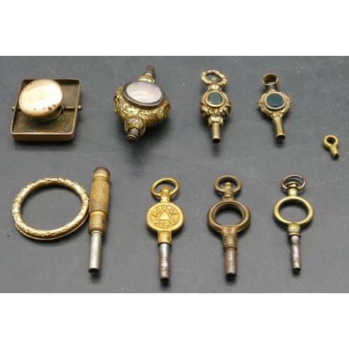 299 - 6 various watch keys and a gilt metal tie clip