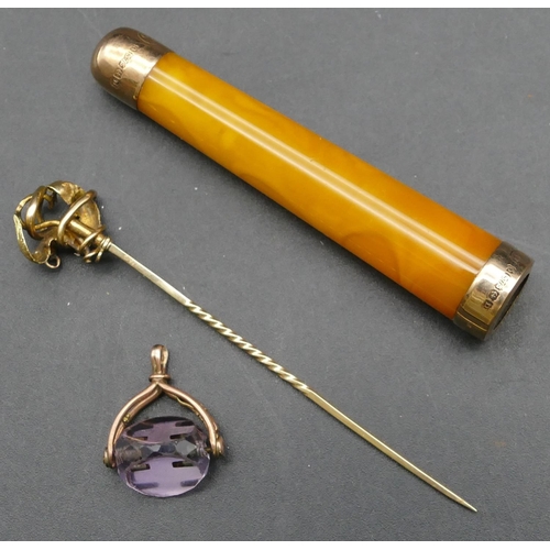 305 - A gold stick pin, a small triangular purple glass pendant seal and an amber cheroot holder with 9ct ... 