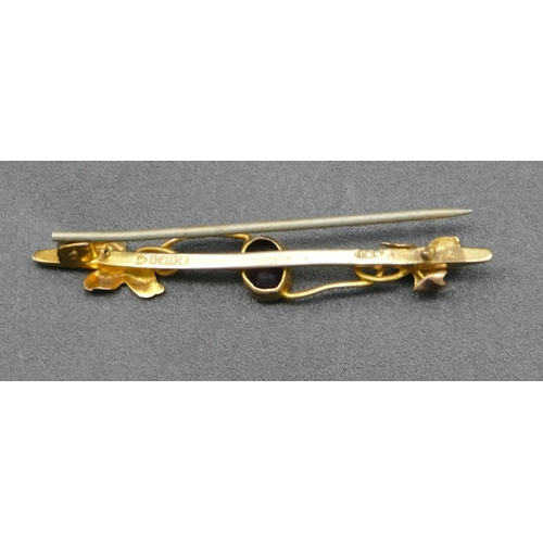 306 - A 9ct gold bar brooch mounted with turquoise, a 9ct gold bar brooch mounted with purple stone and st... 