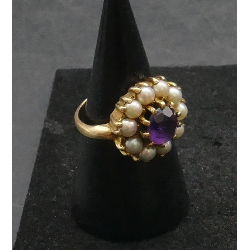 308 - A 9ct gold cluster ring set with centre amethyst surrounded by half pearls, Size K/L, 4.9 grams gros... 