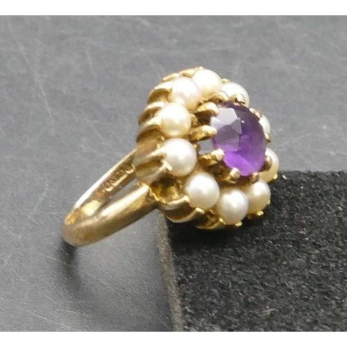 308 - A 9ct gold cluster ring set with centre amethyst surrounded by half pearls, Size K/L, 4.9 grams gros... 