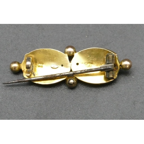 309 - A 15ct gold double oval shaped brooch, 3.2cm long, 1.9 grams